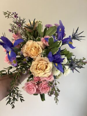 Deluxe Hand Tie Bouquet Medium with 3 premium roses, dahlias, seasonal pastel blooms, and greenery in a 15–20 stem romantic floral arrangement