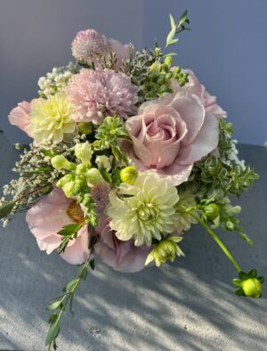 Deluxe Sweet Romance Bouquet with 7 premium roses, lush mixed flowers, and vibrant greenery in a 20–25 stem floral arrangement